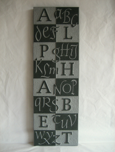 Image of alphabet carved on Green Slate